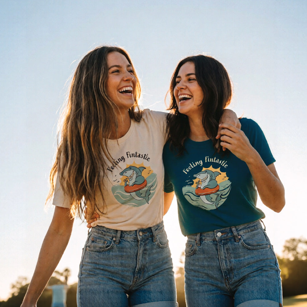 Two women wearing a funny women’s t-shirt with hand-drawn shark design feeling fintastic