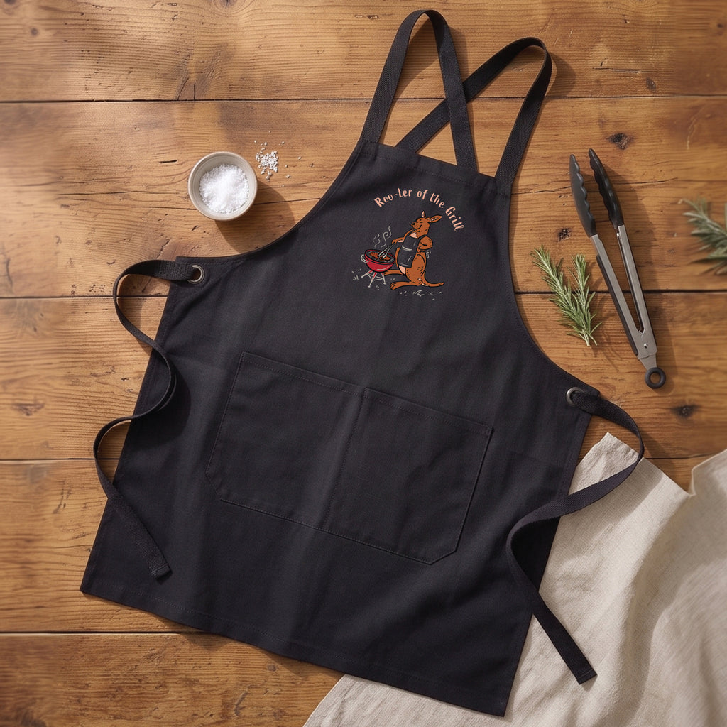 Kangaroo BBQ cotton canvas apron featuring a hand-drawn kangaroo cooking at a barbecue with Roo-ler of the Grill slogan