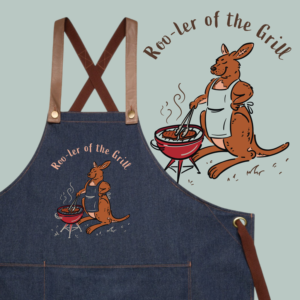 Kangaroo BBQ denim apron featuring a hand-drawn kangaroo cooking at a barbecue with Roo-ler of the Grill slogan