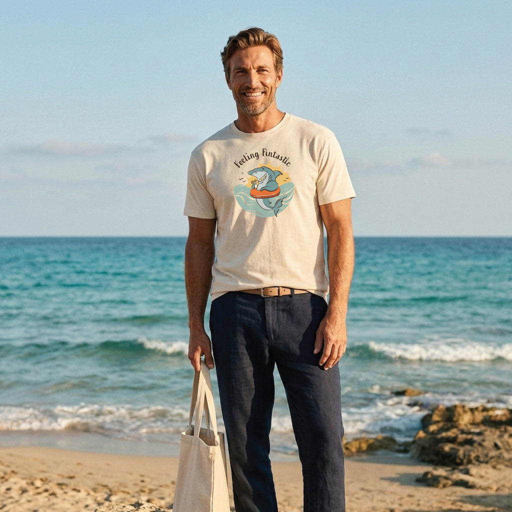 Man wearing a funny shark t-shirt with hand-drawn Feeling Fintastic design in ecru