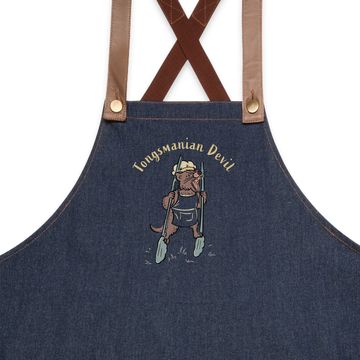 Tasmanian Devil BBQ denim apron featuring a hand-drawn Tassie devil holding cooking tongs with Tongsmanian Devil slogan