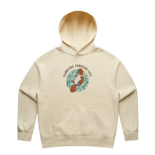 Women’s butter platypus hoodie featuring a hand-drawn platypus floating with floaties, Paddling Through Life design